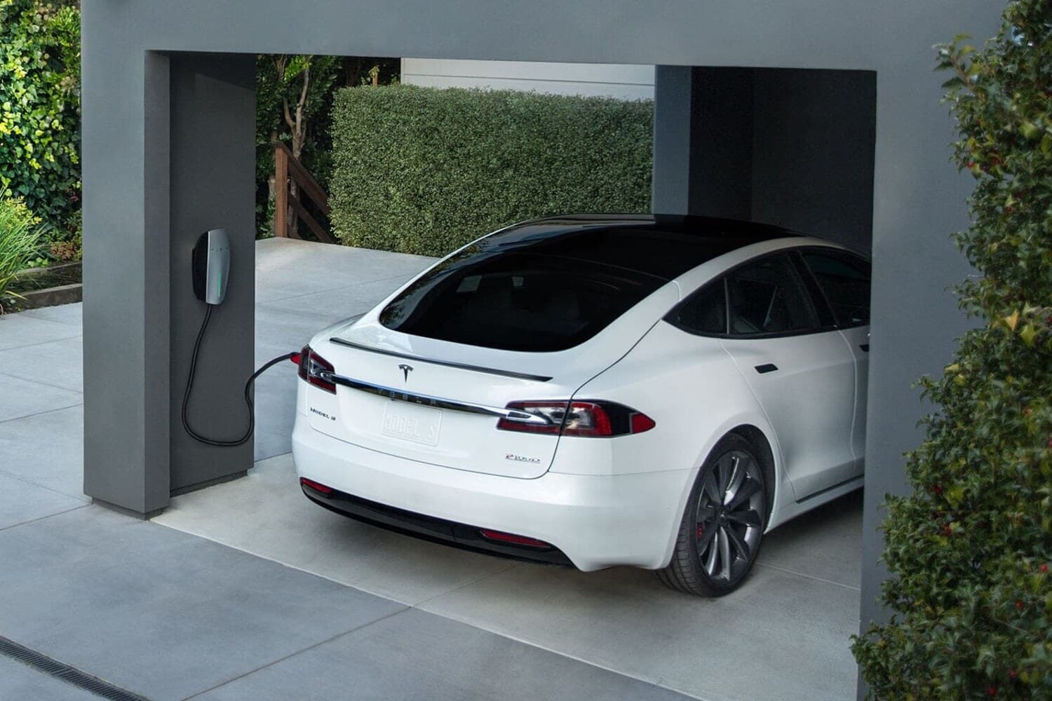 Tesla charging at a home wall connector in an attached garage - Level 2 EV charger installation in Upstate SC
